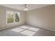 Well-lit bedroom with double window and ceiling fan at 4348 Meadow Vista Dr, Stonecrest, GA 30038