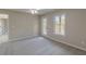 Spacious bedroom with carpet, ceiling fan, and private balcony at 4348 Meadow Vista Dr, Stonecrest, GA 30038