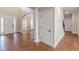 Bright entryway with hardwood floors and coat closet at 4348 Meadow Vista Dr, Stonecrest, GA 30038
