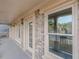 Brick back porch with French doors and windows overlooking the community at 4348 Meadow Vista Dr, Stonecrest, GA 30038