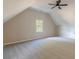Large bonus room featuring a ceiling fan and window at 4348 Meadow Vista Dr, Stonecrest, GA 30038