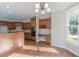 Spacious kitchen boasts ample cabinetry, granite counters, and hardwood floors at 4348 Meadow Vista Dr, Stonecrest, GA 30038