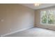 Bright bedroom with large window and neutral decor at 4348 Meadow Vista Dr, Stonecrest, GA 30038