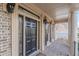 Elegant black front door with sidelights and a transom window at 4348 Meadow Vista Dr, Stonecrest, GA 30038