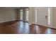 Hardwood floors and large windows in living room at 4348 Meadow Vista Dr, Stonecrest, GA 30038