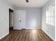 Spacious bedroom with hardwood floors and neutral walls at 7543 Palmetto Way, Riverdale, GA 30274