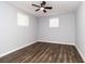 Bright bedroom featuring hardwood floors and neutral walls at 7543 Palmetto Way, Riverdale, GA 30274