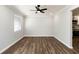 Spacious living room with hardwood floors and a ceiling fan at 7543 Palmetto Way, Riverdale, GA 30274