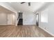 Spacious living area with hardwood floors, stairs, and ceiling fan at 7543 Palmetto Way, Riverdale, GA 30274