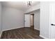 Finished basement with gray walls and hardwood floors at 7543 Palmetto Way, Riverdale, GA 30274