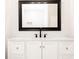Bathroom with white vanity, black matte fixtures, and marble-look tile at 7543 Palmetto Way, Riverdale, GA 30274