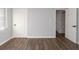 Spacious bedroom with hardwood floors and neutral walls at 7543 Palmetto Way, Riverdale, GA 30274
