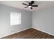 Bright bedroom with hardwood floors and neutral walls at 7543 Palmetto Way, Riverdale, GA 30274