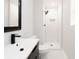 Clean bathroom, featuring a white subway tile shower and modern vanity at 7543 Palmetto Way, Riverdale, GA 30274