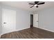 Spacious bedroom with hardwood floors and neutral walls at 7543 Palmetto Way, Riverdale, GA 30274