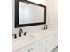 Bathroom with double vanity and quartz countertop at 7543 Palmetto Way, Riverdale, GA 30274