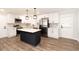 Renovated kitchen, white cabinets, quartz countertops, and stainless steel appliances at 7543 Palmetto Way, Riverdale, GA 30274
