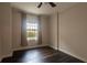 Bedroom with dark hardwood floors and a view from a window at 195 14Th Ne St # 505, Atlanta, GA 30309