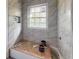 Bathroom with new marble-look tile shower under construction at 10591 Flat Shoals Rd, Covington, GA 30016