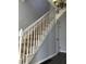 Interior staircase with white railing and carpeted steps at 3021 Stone Mountain St, Lithonia, GA 30058