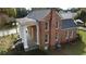 Brick home with a wraparound porch and columns at 3021 Stone Mountain St, Lithonia, GA 30058
