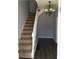 Inviting entryway with hardwood floors and a staircase leading upstairs at 3021 Stone Mountain St, Lithonia, GA 30058
