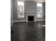 Living room featuring hardwood floors and a fireplace at 3021 Stone Mountain St, Lithonia, GA 30058