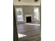 Living room with hardwood floors, fireplace, and large windows at 3021 Stone Mountain St, Lithonia, GA 30058