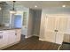 Updated kitchen featuring white cabinets, granite countertops, and hardwood floors at 3021 Stone Mountain St, Lithonia, GA 30058