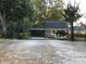 Ornate black gate leading to a charming house at 3021 Stone Mountain St, Lithonia, GA 30058