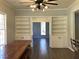 Spacious dining area with built-in shelving and hardwood floors at 3021 Stone Mountain St, Lithonia, GA 30058