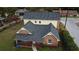 Rear view of the house showing the roofline and yard at 3021 Stone Mountain St, Lithonia, GA 30058