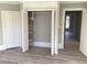 Bedroom with built-in shelving and a spacious closet at 3021 Stone Mountain St, Lithonia, GA 30058