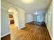 Open living room with wood-look floors and kitchen access at 278 Privette Sw Rd, Marietta, GA 30008
