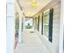 Gray house with a long front porch, white columns, and black shutters at 278 Privette Sw Rd, Marietta, GA 30008