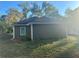 Rear view of house; gray siding, white trim, and a grassy yard at 278 Privette Sw Rd, Marietta, GA 30008