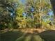 Spacious backyard with mature trees and a grassy area at 278 Privette Sw Rd, Marietta, GA 30008