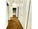 Hallway with brown carpet and doors to bedrooms and other rooms at 278 Privette Sw Rd, Marietta, GA 30008