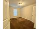 Bright bedroom with brown carpet and window at 278 Privette Sw Rd, Marietta, GA 30008