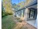 Gray house with black shutters, a front porch, and a grassy yard at 278 Privette Sw Rd, Marietta, GA 30008