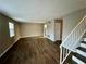 Spacious living room with hardwood floors and stairs at 6354 Shannon Pkwy # 30C, Union City, GA 30291