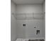 Functional laundry room with shelving and hookups at 58 Longhorn Way, Auburn, GA 30011