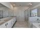 Elegant bathroom with double vanity and large shower at 58 Longhorn Way, Auburn, GA 30011