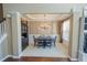 Formal dining room with chandelier, wainscoting, and hardwood floors at 3416 Lost Meadows Ct, Buford, GA 30519