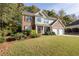 Two-story brick home with attached garage and manicured lawn at 3416 Lost Meadows Ct, Buford, GA 30519