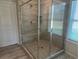 Large walk-in shower with tiled walls and glass enclosure at 27 Longhorn Way, Auburn, GA 30011