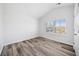 Well-lit bedroom featuring hardwood floors and vaulted ceiling at 200 Haleys Ct, Woodstock, GA 30188