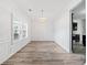 Dining room featuring hardwood floors and a modern chandelier at 200 Haleys Ct, Woodstock, GA 30188