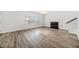 Bright living room featuring hardwood floors and a fireplace at 200 Haleys Ct, Woodstock, GA 30188