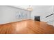 Living room with hardwood floors, fireplace, and large window with shutters at 200 Haleys Ct, Woodstock, GA 30188